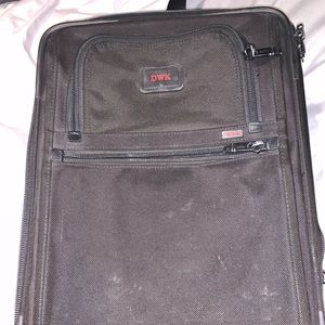 Tumi 20” roller bag in good condition.